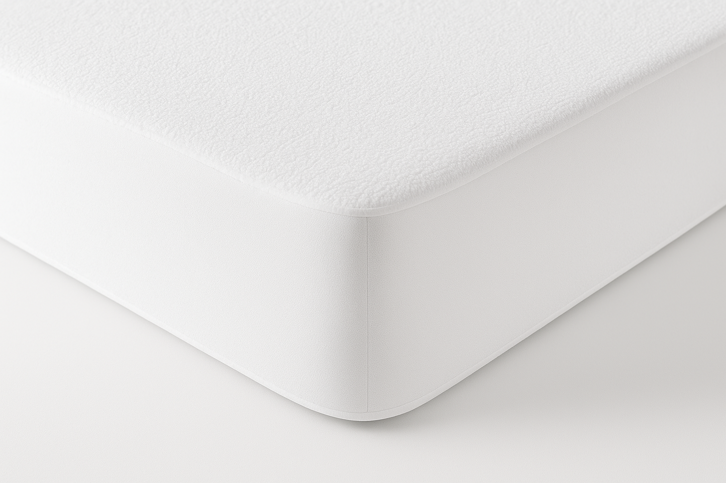 Professional product photography of a 100% waterproof fitted mattress protector in clean white terry cloth texture